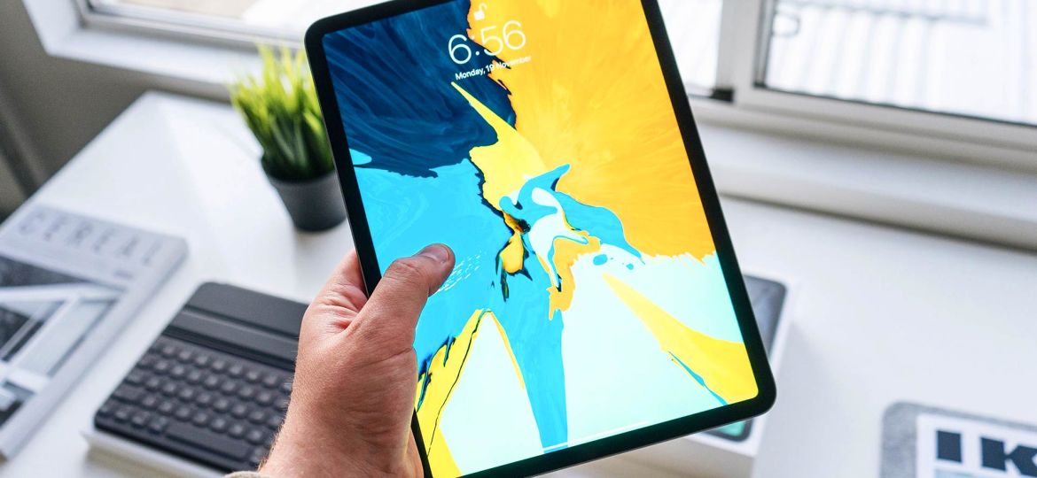 Person Holding Tablet